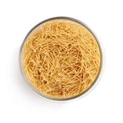 Glass jar filled with dry noodles pasta over isolated white background