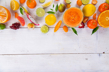 Citrus fruits on a wooden table.