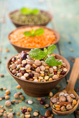Raw legume on old rustic wooden table.