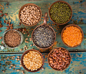 Raw legume on old rustic wooden table.