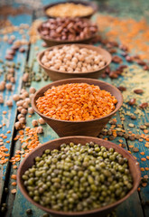 Raw legume on old rustic wooden table.