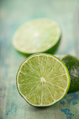 Fresh limes on wooden background