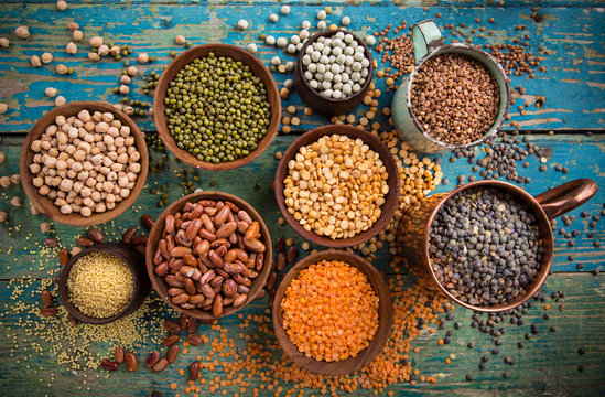 Raw legume on old rustic wooden table.