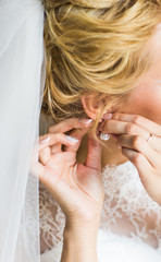 close-up of beautiful woman wearing shiny diamond earrings
