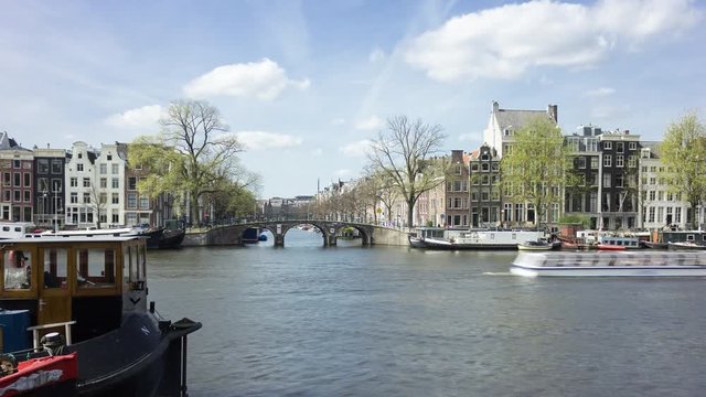 4K time-lapse of boats in the famous canals of Amsterdam, UNESCO world heritage