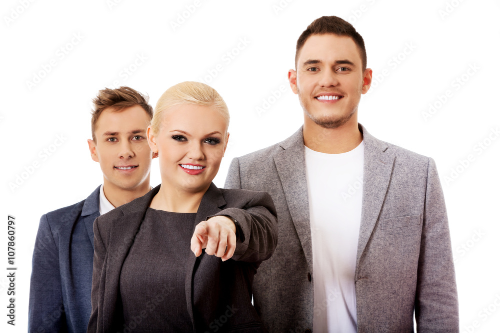 Wall mural business team-woman pointing at camera