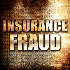 insurance fraud, written on vintage metal texture