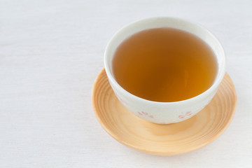 A Cup of Chinese hot tea on white table