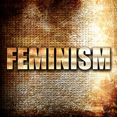 feminism, written on vintage metal texture