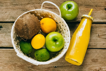 citrus juice with fruits on a wooden table