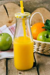 citrus juice with fruits on a wooden table