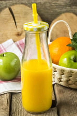 citrus juice with fruits on a wooden table