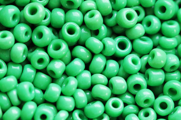 Beads of green colour close up macro photo