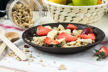 Healthy Breakfast.bowl of cereal with strawberries