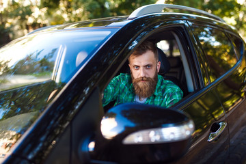 Bearded man in the car