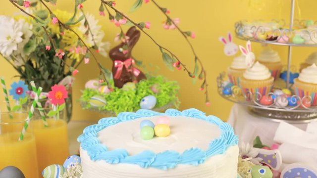 Dessert table set with cake and cupcakes for Easter brunch