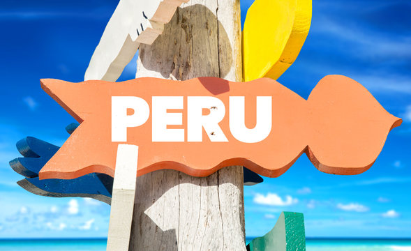 Peru signpost with beach background