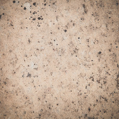 Brown stone wall tile seamless background and texture..