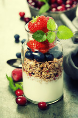 Yogurt with baked granola and berries