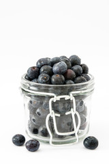 Blueberries in jar. Isolated on white background
