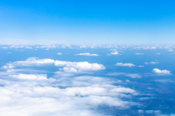 Fototapeta na wymiar above view clouds and earth horizon from airplane