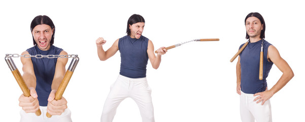 Obraz premium Funny karate fighter with nunchucks on white