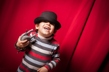child in the theater on red background