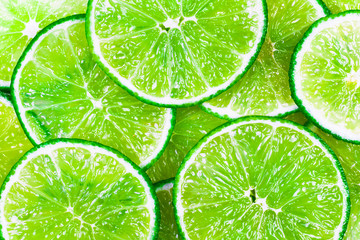 Green background with citrus-fruit of lime slices