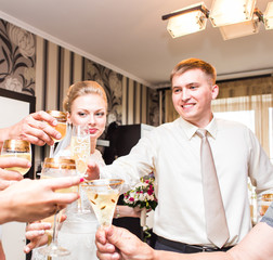 Wedding guests clinking glasses  