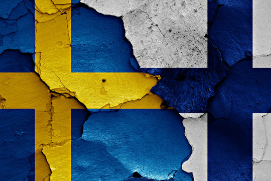 flags of Sweden and Finland painted on cracked wall