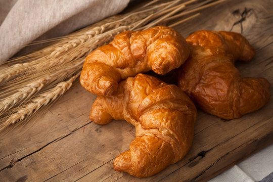 Tasty croissant still life rustic wooden background