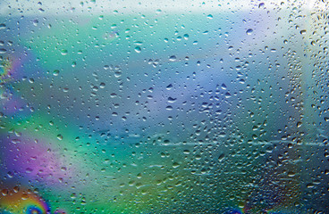 a raindrop on the reflected colored window