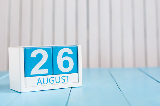 August 26th. Image of august 26 wooden color calendar on blue background. Summer day. Empty space for text