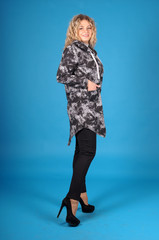 Beautiful young girl  posing on a yellow background