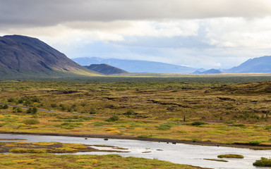 Fototapeta premium Thingvellir National Park. The view across the rift valley of Thingvellir National Park in Iceland. The site is of geological importance and is a popular tourist destinations in Iceland.
