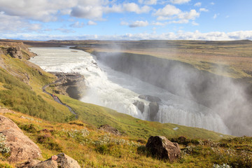 Gullfoss Waterfall.  The view back along the Hvita (white river) river towards Gullfoss (Golden Falls) waterfall in Iceland.  The waterfall forms a part of the popular Golden Circle tourist trail.