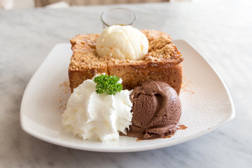 Honey toast with vanilla, chocolate ice-cream and whipped cream