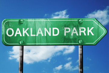 oakland park road sign , worn and damaged look