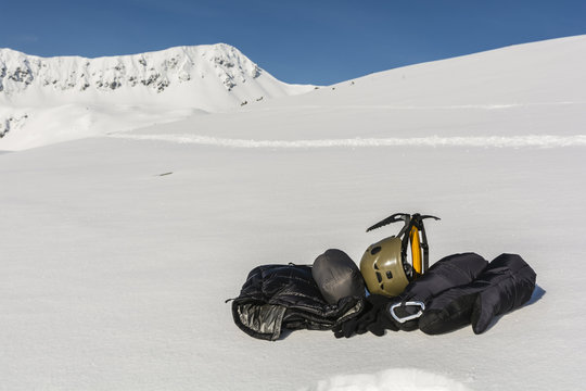 Helmet, ice axe, gloves and clothing down.