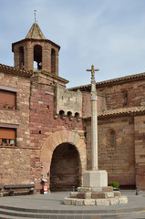 The boundary cross and the ancient gate in the Spanish town Prades