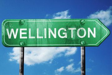 wellington road sign , worn and damaged look