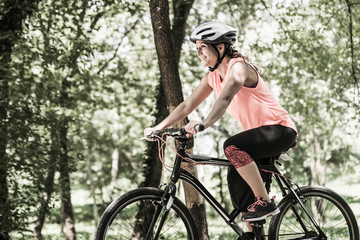 Fototapeta na wymiar Young woman riding bicycle