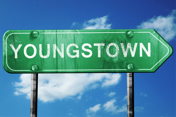 youngstown road sign , worn and damaged look