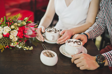 Hands with cups of coffee 5866.