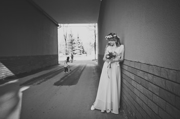 The girl standing at the wall of the house 5898.