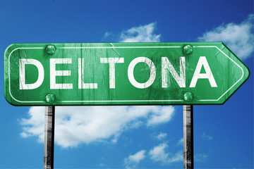 deltona road sign , worn and damaged look