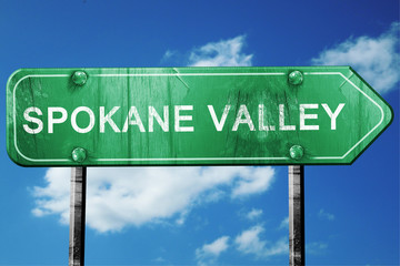 spokane valley road sign , worn and damaged look