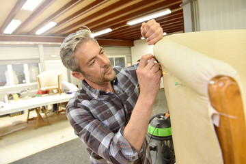 Man working in upholstery workshop