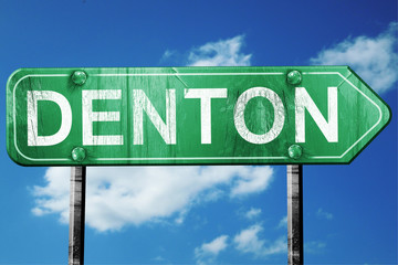 denton road sign , worn and damaged look