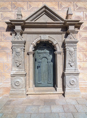 Fototapeta na wymiar Old door in a stone building of castle in Cesis town